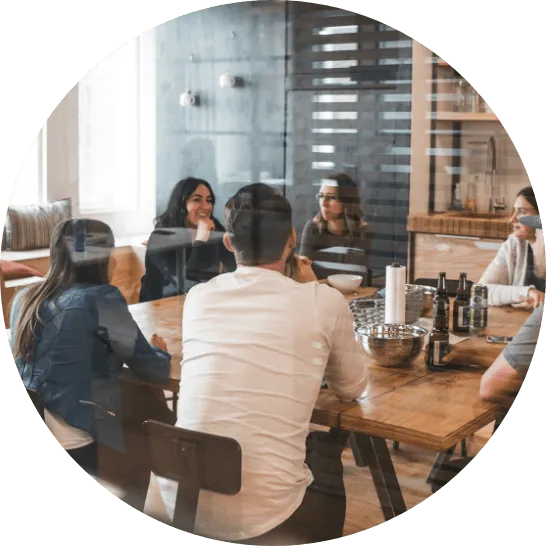 Tidal Accounting | a group of people having a meeting around a table